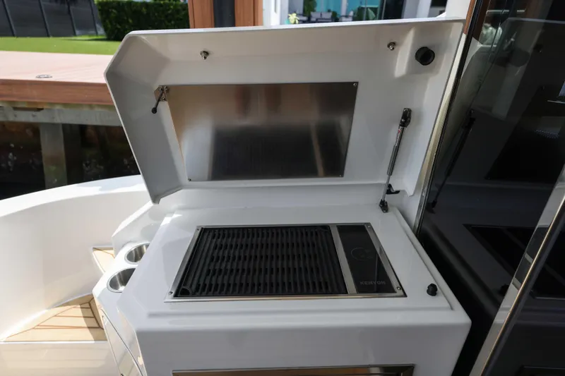 Slide: The Image of Outdoor grill station on 2016 Cruisers Yachts 45 Cantius, featuring sleek design and functionality. - 28