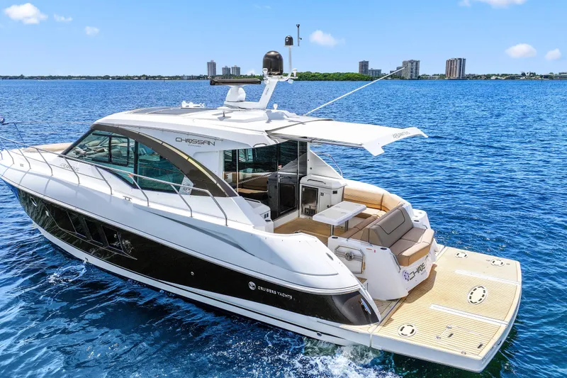 Slide: The Image of 2016 Cruisers Yachts 45 Cantius on blue water, showcasing sleek design and luxury features. - 15