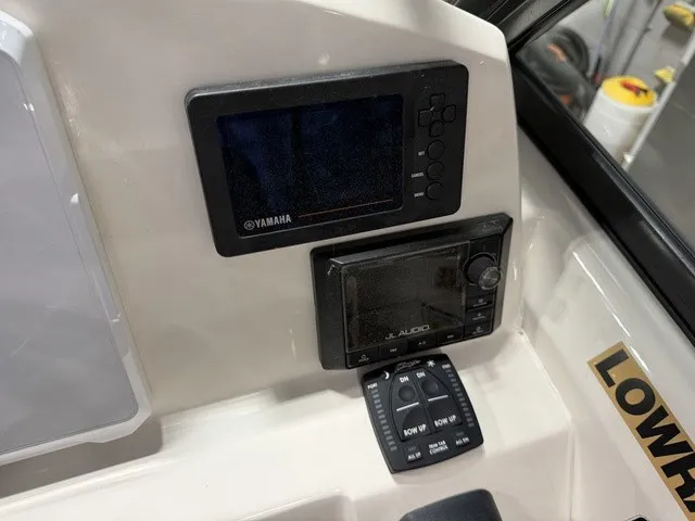Slide: The Image of The image shows the dashboard of a Cobia 240DC boat with Yamaha and JL Audio equipment. - 22