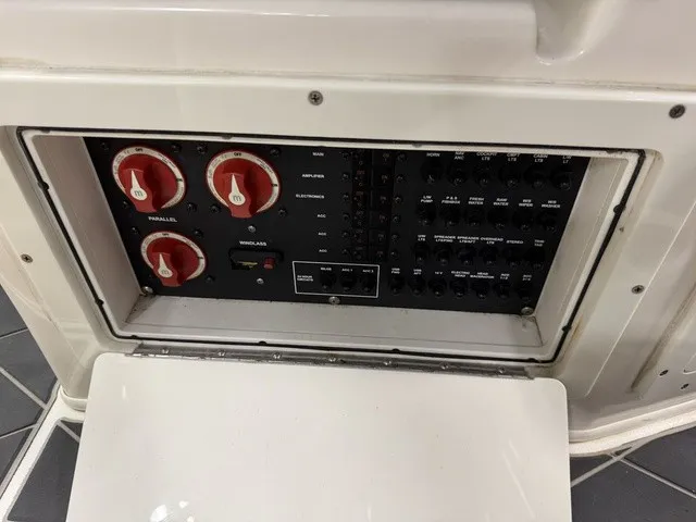 Slide: The Image of Electrical panel of a 2020 Cobia 240DC with switches and indicator lights. - 18