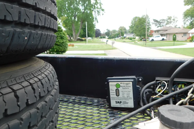 Slide: The Image of Trailer bed with spare tires and break-away system, Fountain 38 LX, 2006 model. - 88