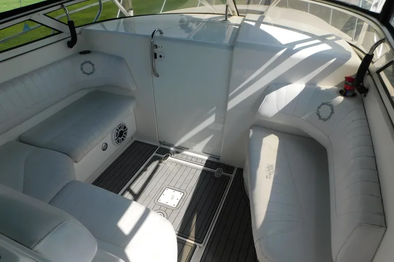 Slide: The Image of 2006 Fountain 38 LX boat interior with white seating and sleek design. - 36