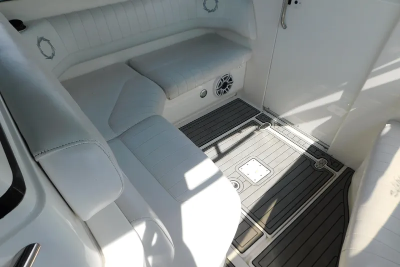 Slide: The Image of Interior of 2006 Fountain 38 LX boat with white seating and gray flooring. - 34