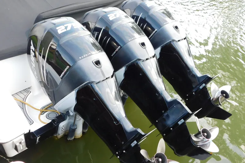 Slide: The Image of Triple Mercury Verado outboard engines on a 2006 Fountain 38 LX boat. - 5