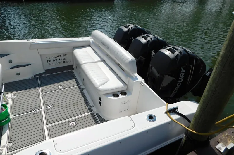 Slide: The Image of 2006 Fountain 38 LX boat with triple Mercury engines and spacious seating area. - 9