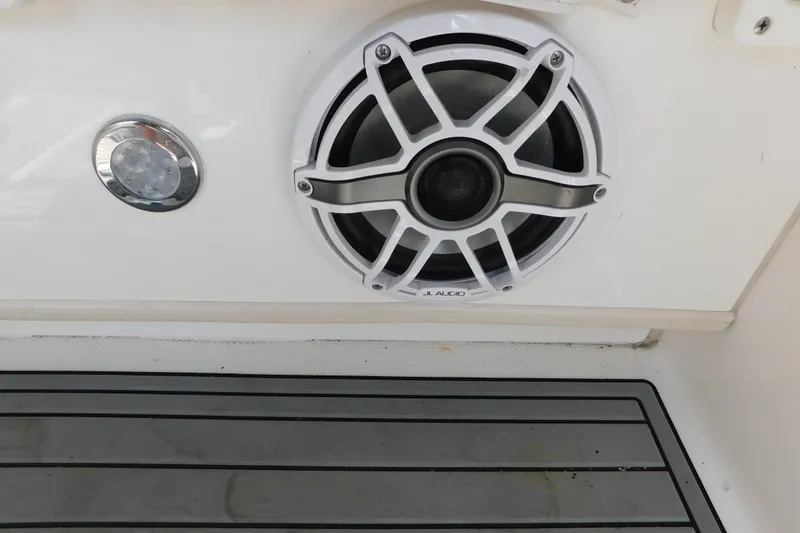 Slide: The Image of Speaker and light fixture on 2006 Fountain 38 LX boat interior. - 37