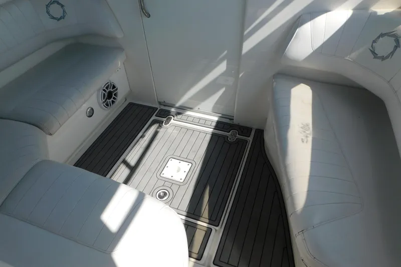 Slide: The Image of Interior seating area of a 2006 Fountain 38 LX boat with cushioned seats. - 33
