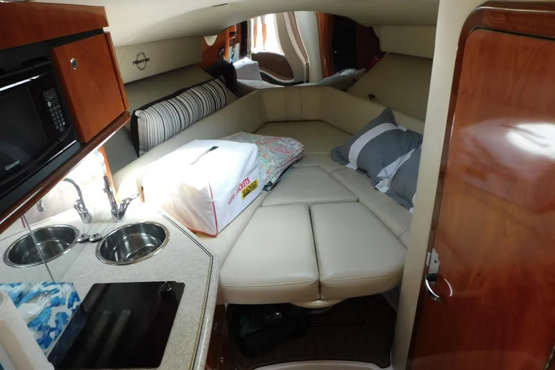 Slide: The Image of 2006 Fountain 38 LX cabin interior with kitchenette, bed, and modern amenities. - 41