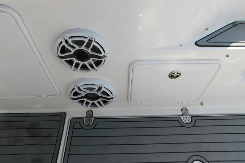 Slide: The Image of 2006 Fountain 38 LX boat interior with speakers and storage compartments. - 17