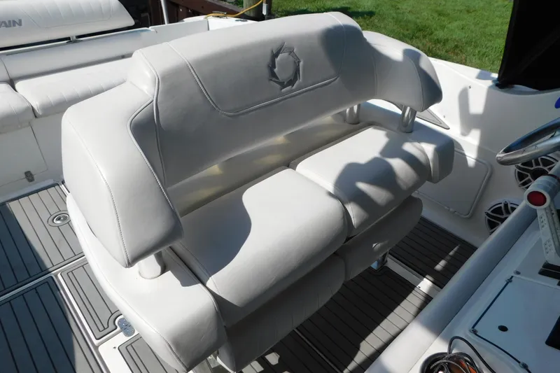 Slide: The Image of Luxurious seating on a 2006 Fountain 38 LX boat, featuring sleek white upholstery. - 13