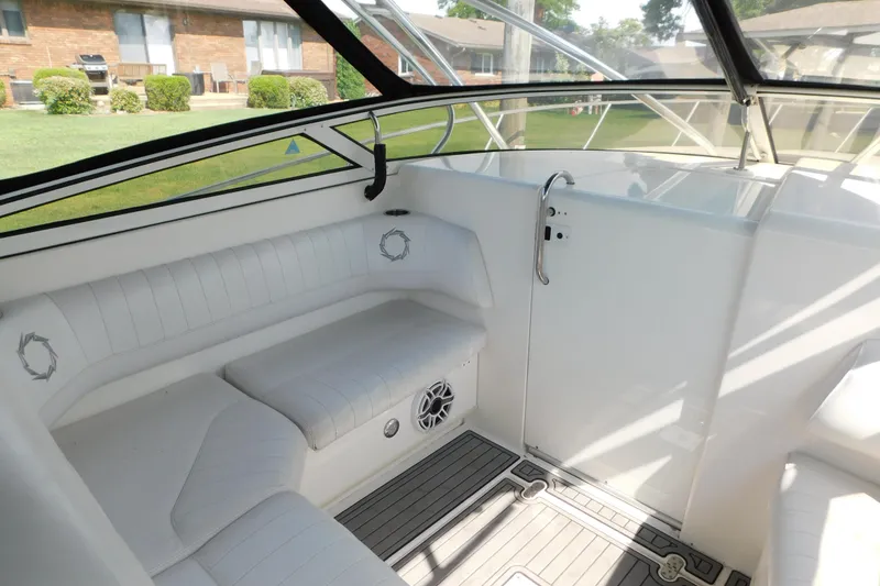 Slide: The Image of 2006 Fountain 38 LX boat interior with white seating and sleek design. - 35