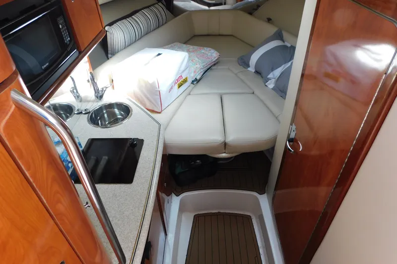 Slide: The Image of Interior of 2006 Fountain 38 LX boat with kitchenette and cozy sleeping area. - 40