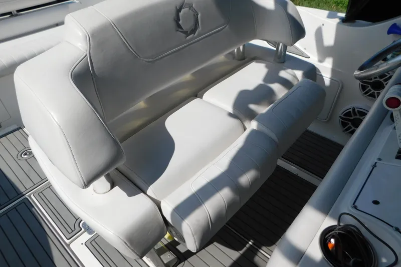 Slide: The Image of 2006 Fountain 38 LX boat interior with white leather seating and modern design. - 15