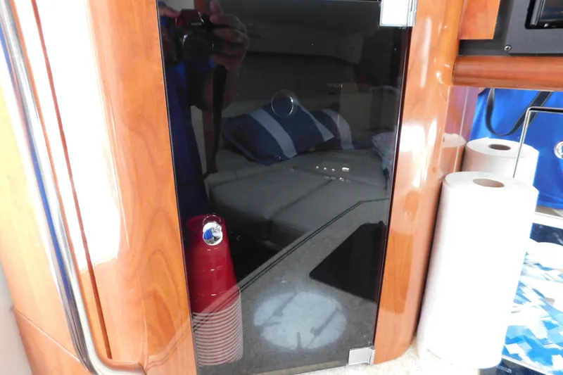 Slide: The Image of Interior of 2006 Fountain 38 LX boat with wooden cabinetry and paper towels. - 52