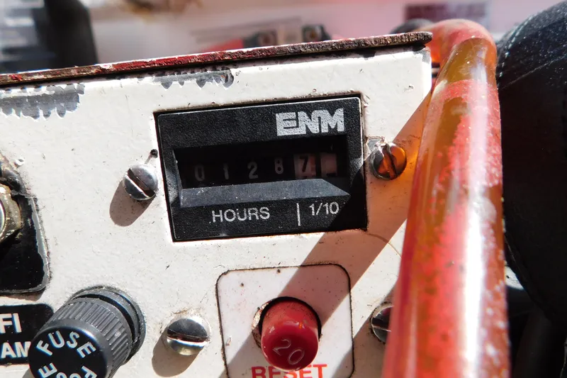Slide: The Image of Hour meter on a 2006 Fountain 38 LX boat, displaying 1287.1 hours. - 79