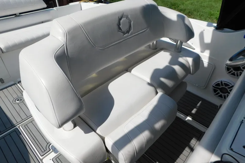 Slide: The Image of White leather seating on a 2006 Fountain 38 LX boat, featuring sleek design and comfort. - 14
