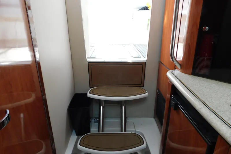 Slide: The Image of Interior of 2006 Fountain 38 LX boat with wooden cabinetry and seating. - 64