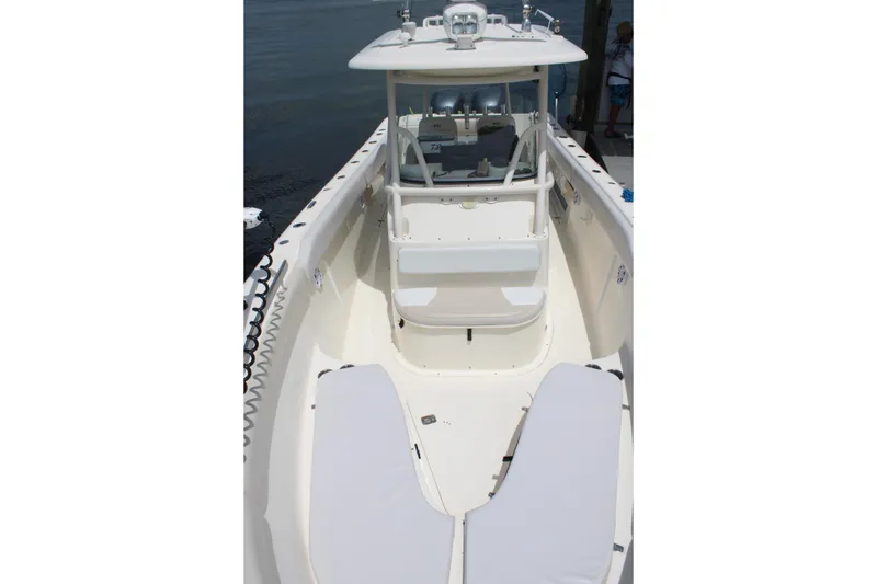 Slide: The Image of 2009 Pursuit C 310 Center Console boat with spacious deck and seating. - 11