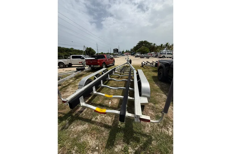 Slide: The Image of Boat trailer for 2009 Pursuit C 310 Center Console in parking lot. - 15