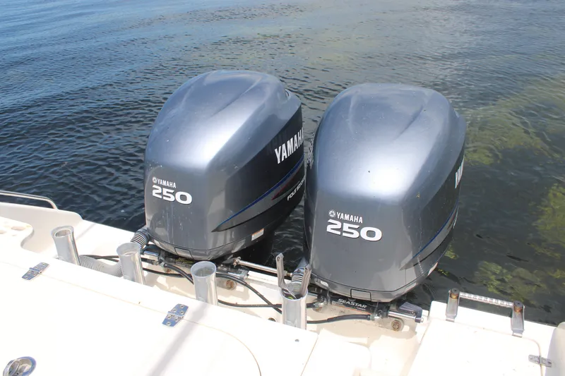 Slide: The Image of Twin Yamaha 250 outboard engines on a 2009 Pursuit C 310 Center Console boat. - 5