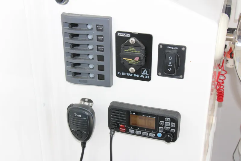 Slide: The Image of Control panel of 2022 Steiger Craft 21 Miami boat with switches and radio. - 32