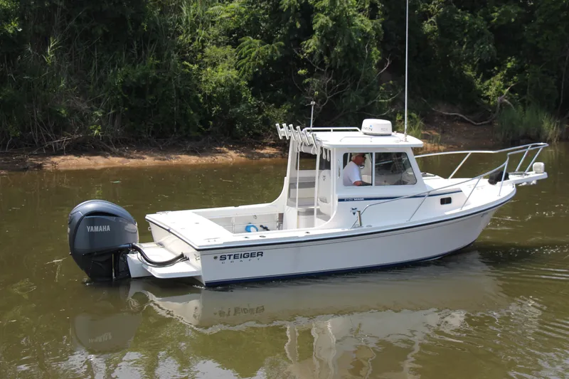 Slide: The Image of 2022 Steiger Craft 21 Miami boat with Yamaha engine on calm water. - 13