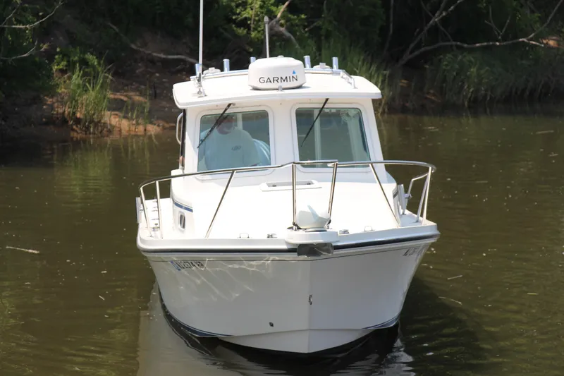 Slide: The Image of 2022 Steiger Craft 21 Miami boat on calm water, front view. - 17