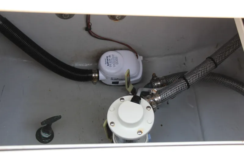 Slide: The Image of 2022 Steiger Craft 21 Miami boat interior showing pump and hoses. - 24