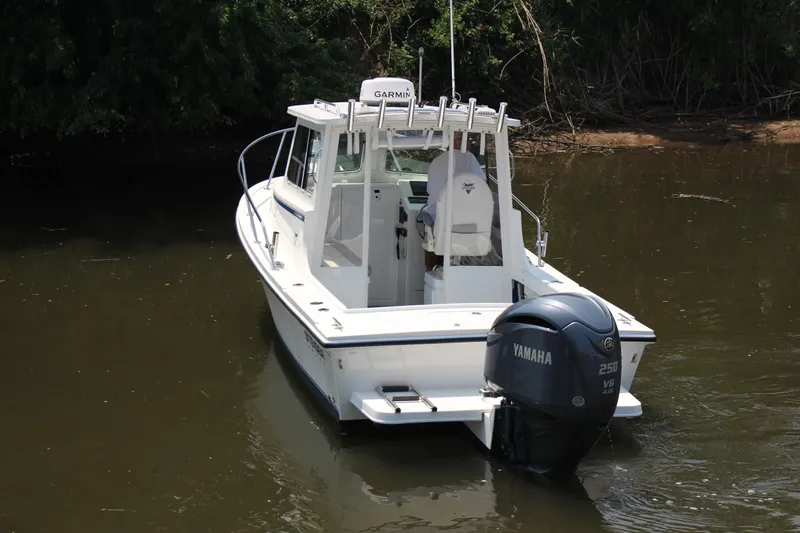 Slide: The Image of 2022 Steiger Craft 21 Miami boat with Yamaha 250 V6 engine on calm water. - 9