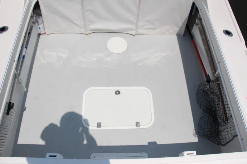Slide: The Image of Interior view of 2022 Steiger Craft 21 Miami boat deck, featuring storage compartments. - 28