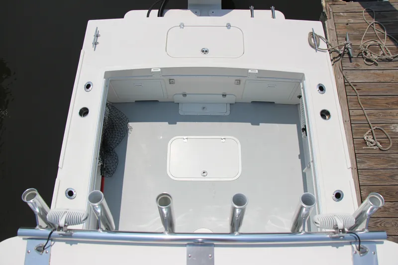 Slide: The Image of 2022 Steiger Craft 21 Miami boat deck with rod holders and storage compartments. - 29