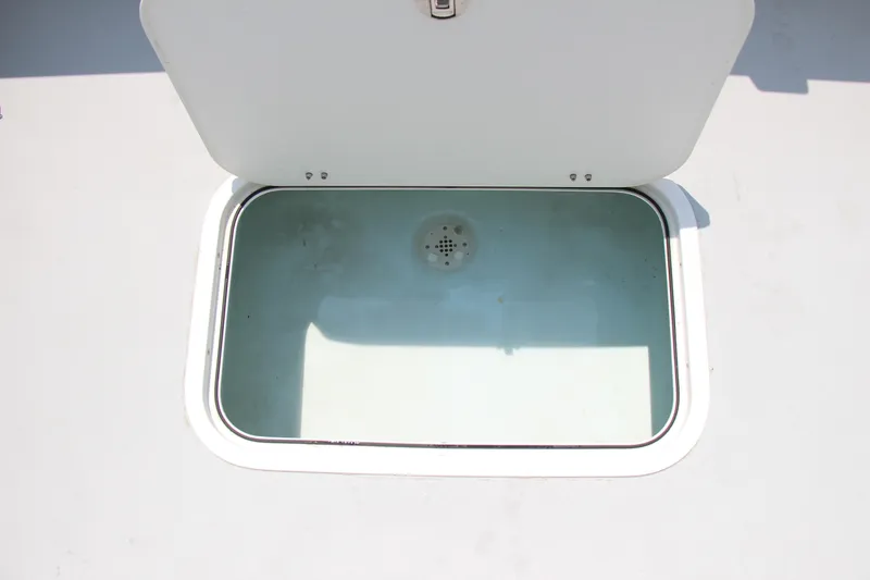 Slide: The Image of Open storage compartment on 2022 Steiger Craft 21 Miami boat. - 27