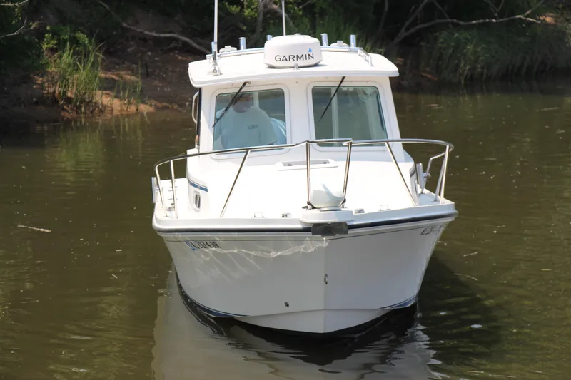 Slide: The Image of 2022 Steiger Craft 21 Miami boat on calm water, front view. - 18