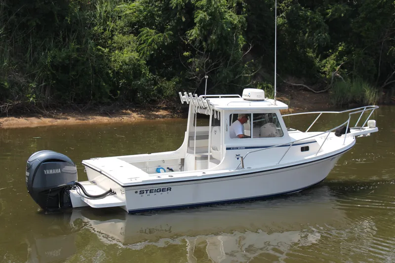 Slide: The Image of 2022 Steiger Craft 21 Miami boat with Yamaha engine on a calm river. - 12
