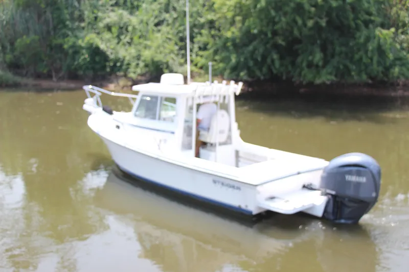 Slide: The Image of 2022 Steiger Craft 21 Miami boat with Yamaha engine on a calm river. - 7