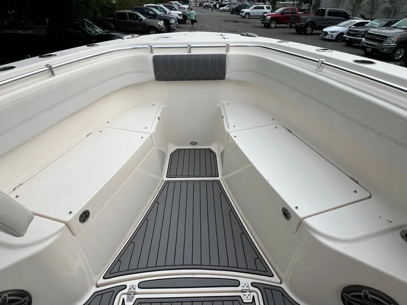 Slide: The Image of The image shows the spacious bow area of a 2020 Cobia 280 Center Console boat. - 16