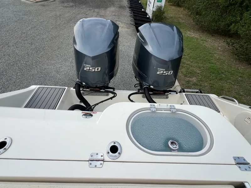 Slide: The Image of Two Yamaha 250 outboard engines are mounted on the stern of a Cobia 280 Center Console boat. - 13