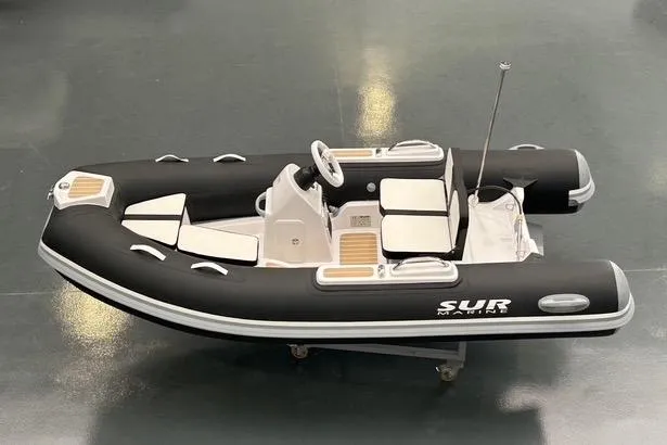 The Image of 2027 SUR Marine ST 330 Classic inflatable boat with sleek black and white design. - 1