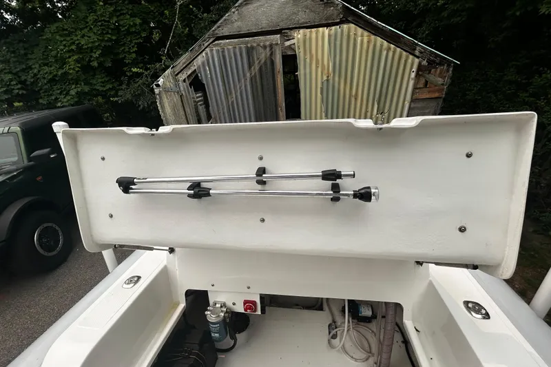 Slide: The Image of 2022 AB Inflatables Nautilus 19 DLX boat storage compartment with open lid and equipment. - 11