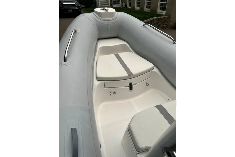 Slide: The Image of 2022 AB Inflatables Nautilus 19 DLX boat interior with cushioned seating and sleek design. - 9