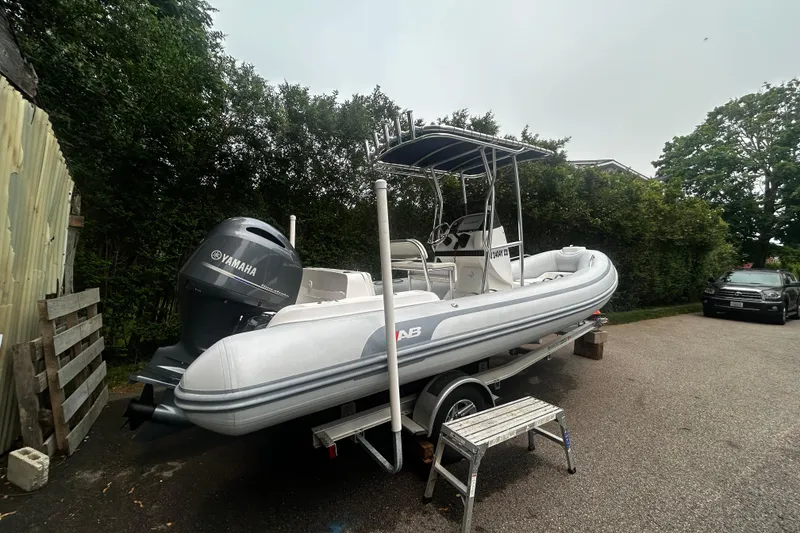 Slide: The Image of 2022 AB Inflatables Nautilus 19 DLX boat on trailer with Yamaha engine. - 1
