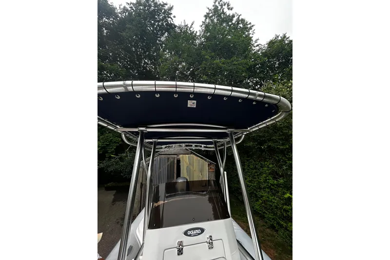 Slide: The Image of 2022 AB Inflatables Nautilus 19 DLX boat with canopy, surrounded by trees. - 5