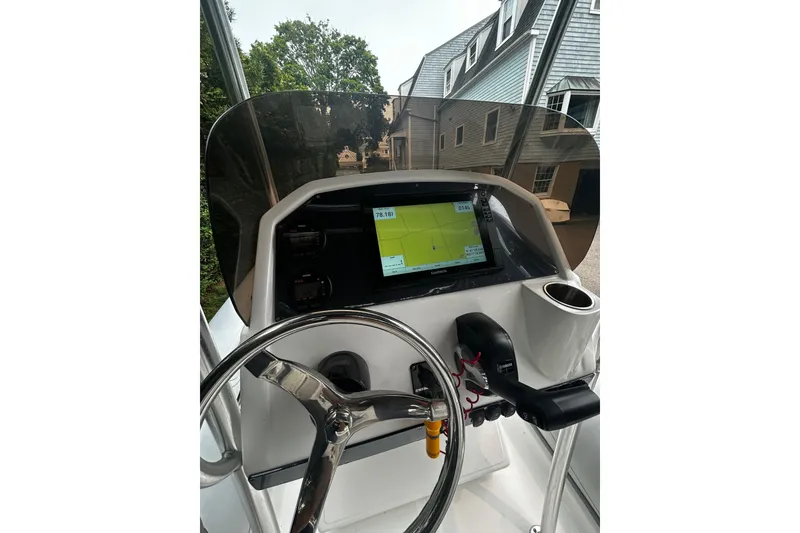 Slide: The Image of 2022 AB Inflatables Nautilus 19 DLX boat dashboard with GPS and steering wheel. - 6