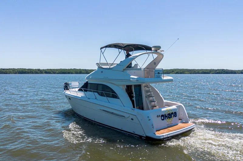 Slide: The Image of 2005 Meridian 341 Sedan cruising on a sunny lake with clear blue skies. - 13