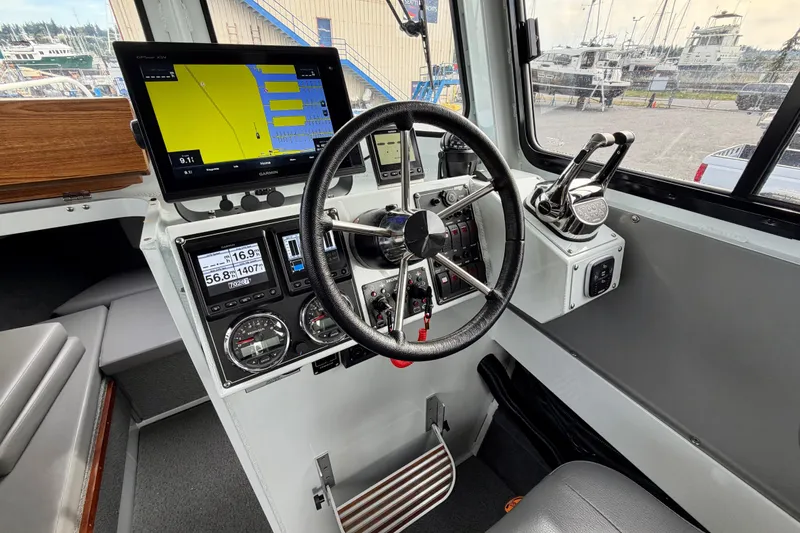 Slide: The Image of 2018 Hewescraft 260 Pacific Explorer helm with advanced navigation and control systems. - 4
