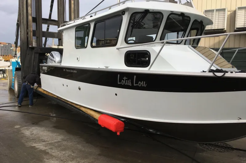 Slide: The Image of 2018 Hewescraft 250 Pacific Explorer boat being serviced at a dockyard. - 4