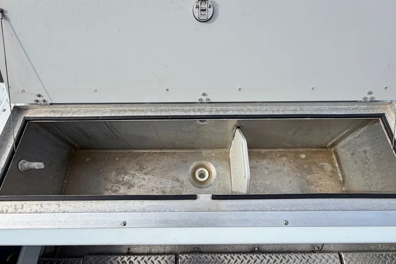 Slide: The Image of Open storage compartment on 2018 Hewescraft 260 Pacific Explorer boat. - 10