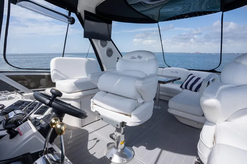 Slide: The Image of Luxurious 2006 Sea Ray 455 Sedan Bridge yacht interior with plush white seating. - 27