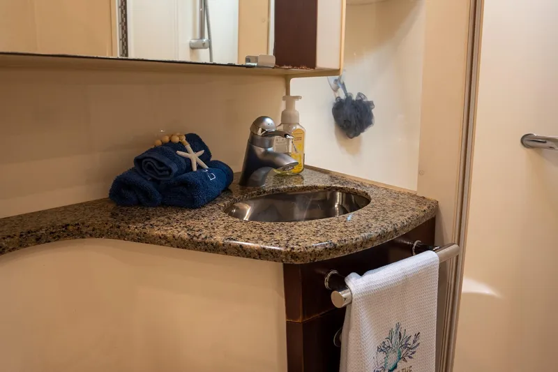 Slide: The Image of Luxurious bathroom sink area in 2006 Sea Ray 455 Sedan Bridge yacht. - 30
