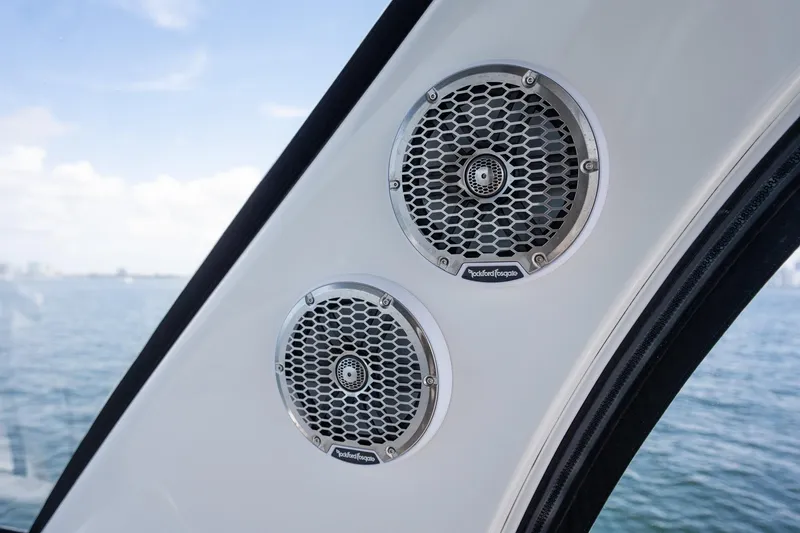 Slide: The Image of Speakers on 2006 Sea Ray 455 Sedan Bridge yacht with ocean view in background. - 16